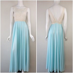 May include: A light blue maxi dress with a white lace bodice. The dress has a scoop neckline and a sleeveless design.