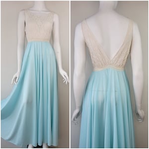 May include: A light blue maxi dress with a white lace bodice. The dress has a scoop neckline and a sleeveless design.