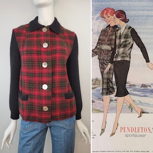 May include: A long-sleeved jacket featuring a red and green plaid pattern on the front and back panels, with solid black knit sleeves and a black collar. The jacket has five light-colored buttons down the center and two small black pockets.