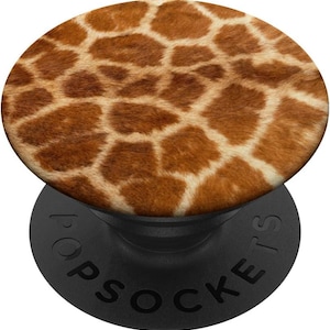 May include: A brown and white giraffe print phone grip with a black base. The grip has the word "POPSOCKETS" printed on the base.