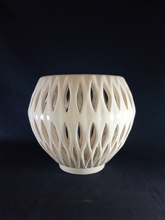 Ceramic pot for orchids. The original form. Glazed white color.
