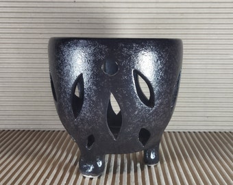 Small pot for orchids. The black color is covered with tonic dot glaze. Creates a shiny water splash effect.