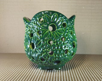 Ceramic pot for orchids with floral pattern and round holes. Pot in the shape of a flower. Handwork.