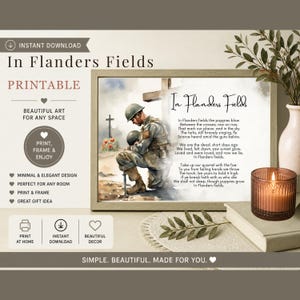May include: A framed print of the poem "In Flanders Fields" with an illustration of a soldier kneeling at a cross. The print includes the text "PRINTABLE" and "BEAUTIFUL ART FOR ANY SPACE". A candle and vase are in the foreground.