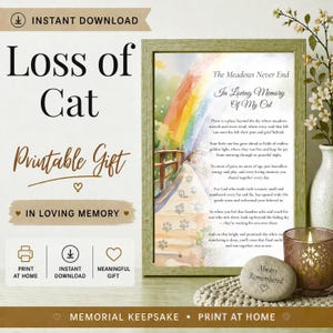 Op de afbeelding: Een ingelijste print met de tekst "Loss of Cat" en "Printable Gift". Het kunstwerk toont een regenboog over een pad, met de woorden "In Loving Memory Of My Cat". Een kaars en een steen met "Always Remembered" zijn ook aanwezig.
