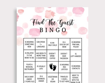 May include: A baby shower bingo game card with a pink watercolor background. The text "Find The Guest BINGO" is at the top. The bingo squares contain prompts like "Is wearing something new" and "Is a dog or cat mom."