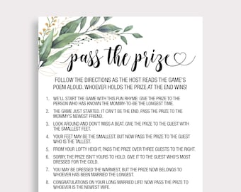 May include: A printable game card with a green and gold floral design. The card has the title "Pass the Prize" and instructions for a game where guests pass a prize around according to a rhyming poem.