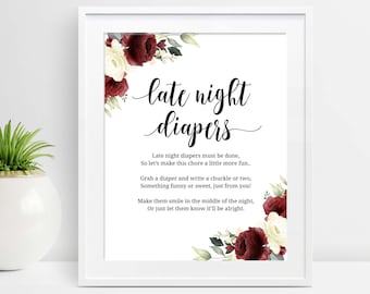 May include: White framed print with the words "late night diapers" in elegant script. The print includes a poem about making diaper changes fun, with floral accents in burgundy and cream.