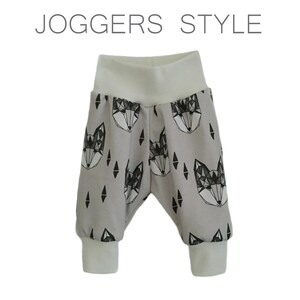 May include: Gray joggers with a white waistband and black geometric fox print. "JOGGERS STYLE" is written in white text at the top of the image.