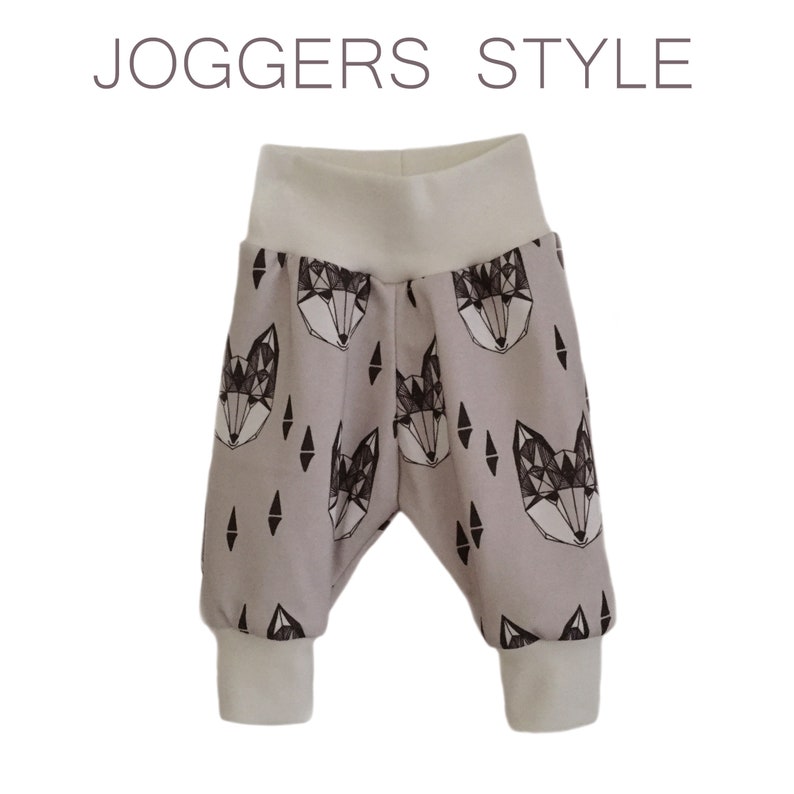 May include: Gray joggers with a geometric fox print and white cuffs. The joggers have the text "JOGGERS STYLE" at the top of the image.