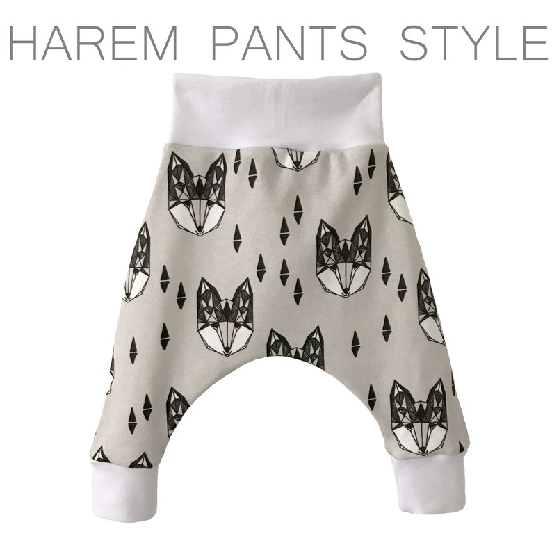 May include: Gray harem pants with a white geometric fox print. The pants have a white waistband and white cuffs.