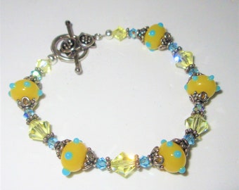 Yellow Blue Lampwork Glass bead Bracelet, 8 inch of Blue and Yellow Cut Crystals, Sterling Silver spacers,gorgeous toggle/Ring,one of a kind