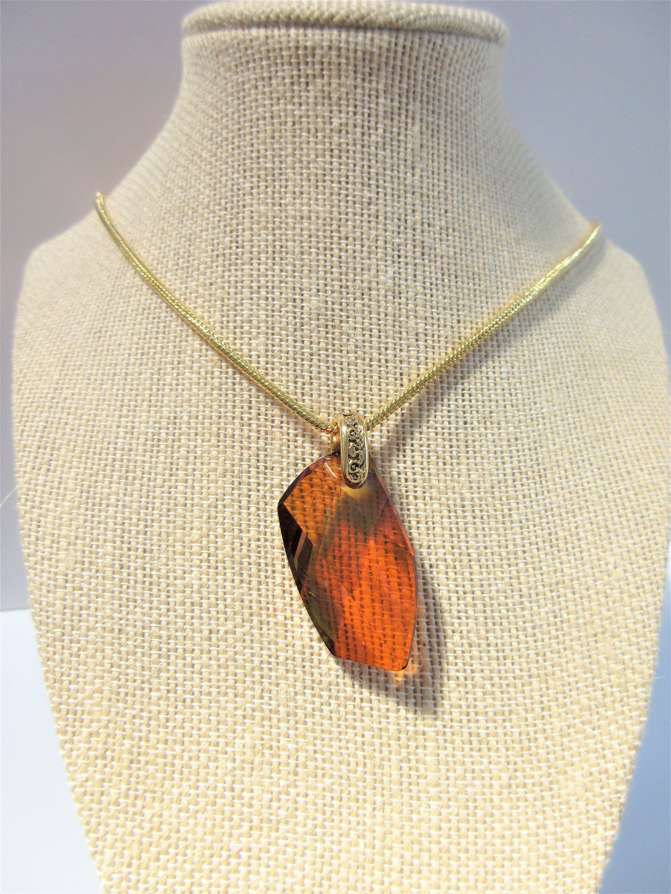 Swarovski Crystal dark amber pendant on 