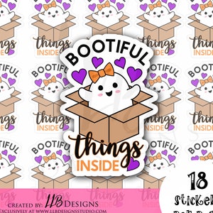 May include: A set of 18 stickers featuring a cute ghost in a box with the text "Bootiful things inside". The ghost is white with purple hearts and a yellow bow. The box is brown with orange accents. The stickers are perfect for adding a touch of whimsy to your planner, laptop, or water bottle.