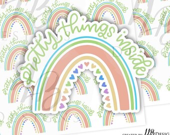 May include: A sticker with a rainbow design and the text "pretty things inside". The rainbow is made up of five colors: green, blue, yellow, orange, and pink. The rainbow is outlined in white and has small hearts in the center.