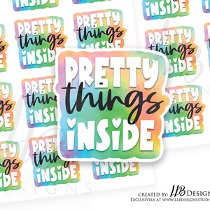 May include: A set of 10 colorful stickers with the text "Pretty things inside" in black lettering. The stickers have a watercolor-like background with a rainbow color scheme.