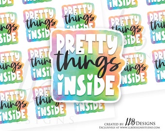 May include: A set of 10 colorful stickers with the text "Pretty things inside" in black lettering. The stickers have a watercolor-like background with a rainbow color scheme.