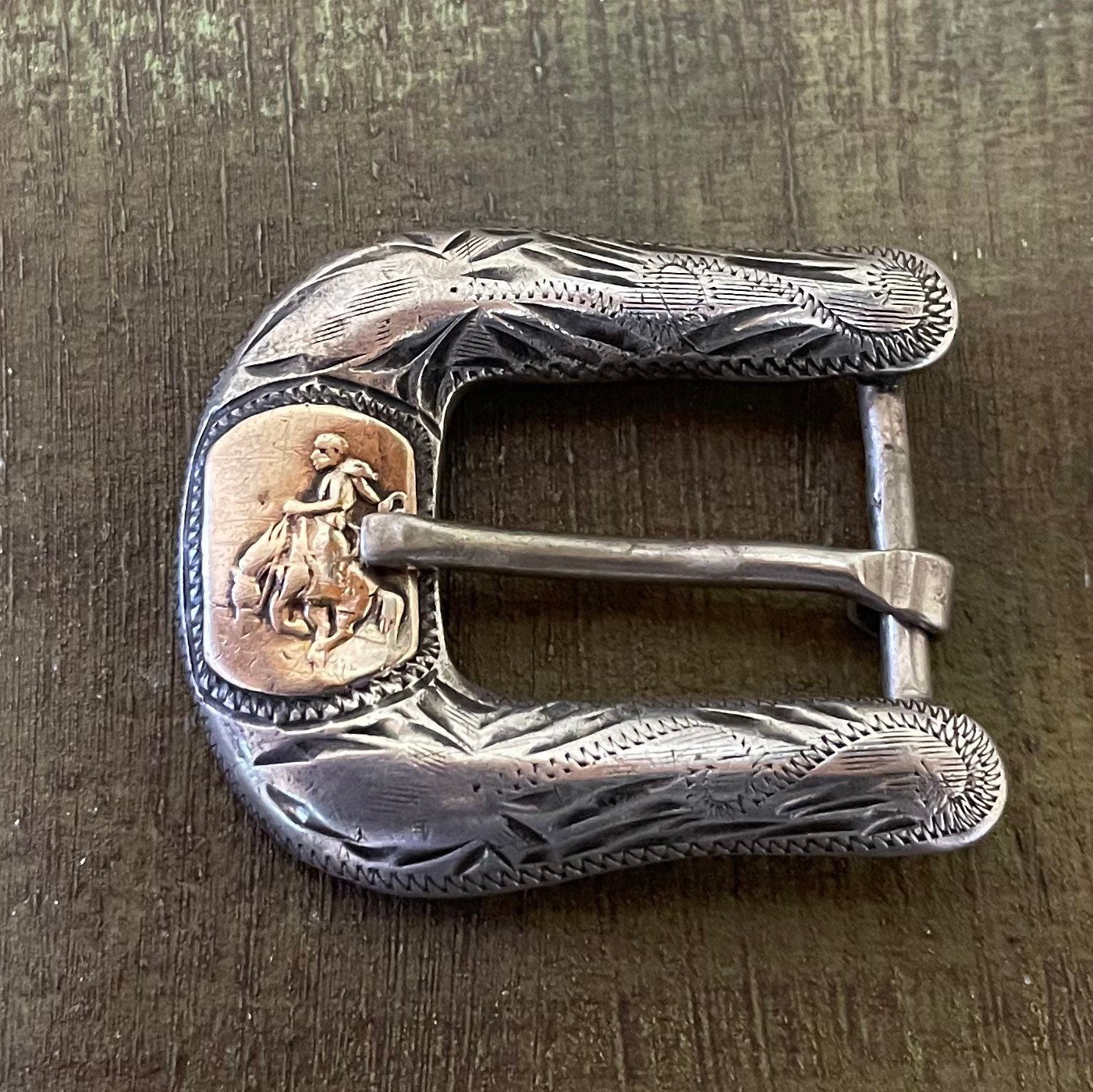 Rhinestone Cowboy: Clint Orms's Custom Belt Buckles a Work of Art