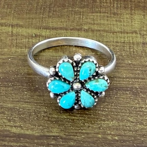 May include: A rustic wooden sign with the text "Welcome to our home" in white lettering. The sign features a distressed finish and a simple, inviting design, perfect for entryway decor.