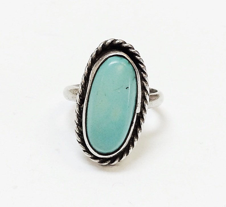 Sterling silver ring w oval cut turquoise stone. #-0361