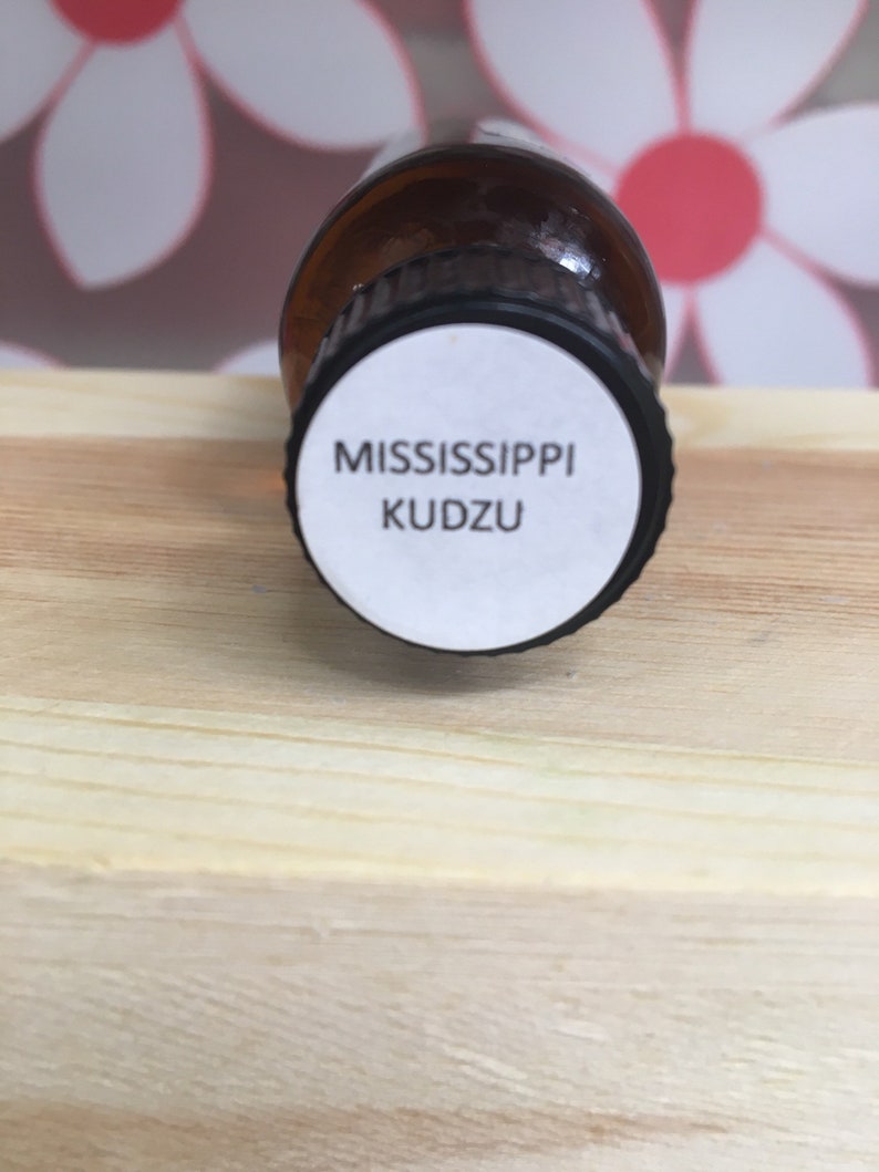 May include: A brown glass bottle with a white label that reads "MISSISSIPPI KUDZU".