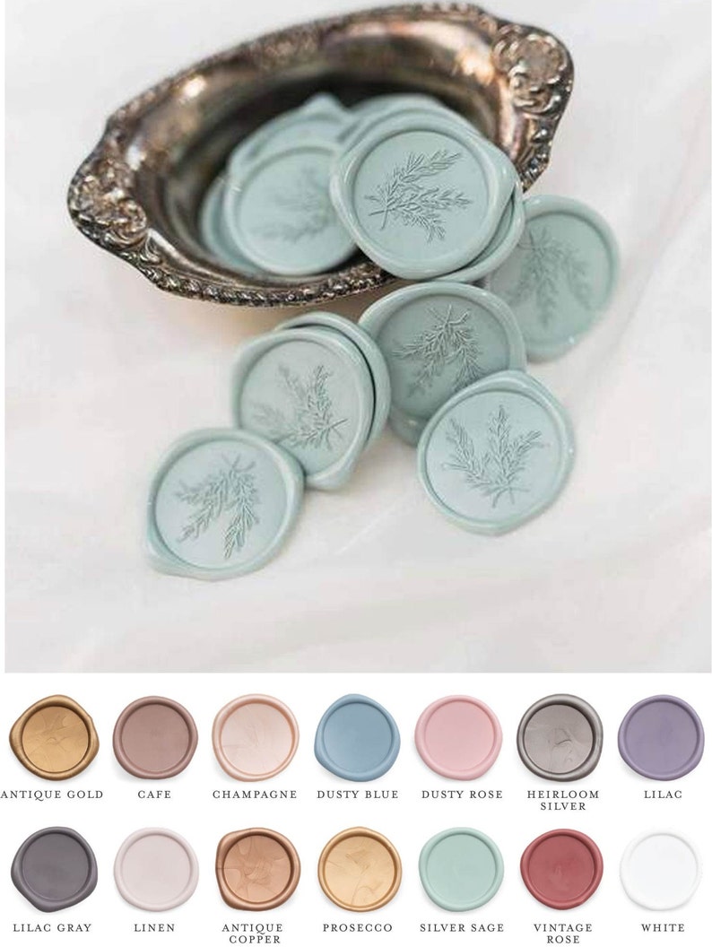 May include: A collection of round wax seals in various colours, including antique gold, cafe, champagne, dusty blue, dusty rose, heirloom silver, lilac, lilac grey, linen, antique copper, prosecco, silver sage, vintage rose, and white. Each seal features a delicate floral design.
