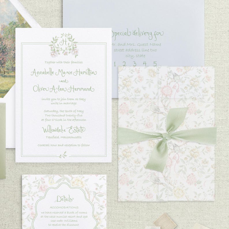 May include: A wedding invitation suite with a floral design. The invitation card features a green wreath with the couple's names and wedding date. The RSVP card has a floral border and the text "Details".