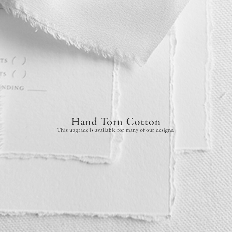 May include: Close-up of white cotton paper with a torn edge. The text "Hand Torn Cotton" is printed on the paper, along with the text "This upgrade is available for many of our designs."