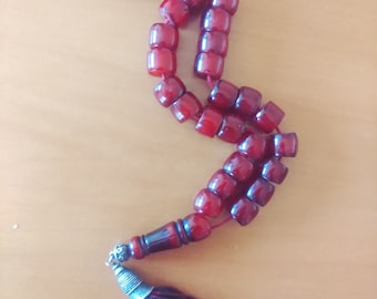 Faturan red amber 100% Egyptian. Definition of faturan. Milky Amber Swirle in each bead.More than 200 old paesan cut, big beads