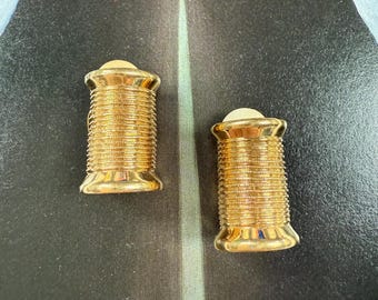 Couture Vintage Nina Ricci earrings in the shape of a thread   spool in gold tone still in their original packaging Designer clip ons