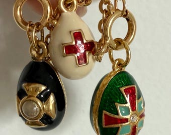 Vintage Easter enameled egg charm bracelet with cross theme by Joan Rivers in the style of Faberge