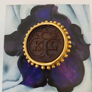 RARE vintage Karl Lagerfeld logo Chanel era brooch with a tree of life and Content is a treasure quote on the back Statement gold tone pin