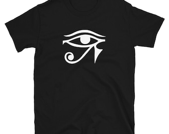 May include: Black t-shirt with a white graphic of the Eye of Horus, an ancient Egyptian symbol.