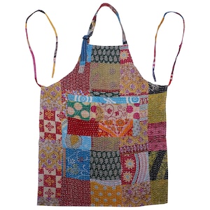 May include: A patchwork apron with a variety of colorful fabric squares. The apron has a pocket and long ties for the neck and waist. The design includes floral and geometric patterns in red, blue, yellow, and green.