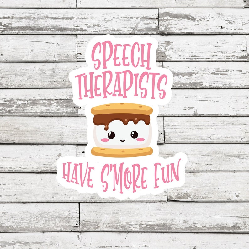 May include: A white sticker with pink text that reads "Speech Therapists Have S'more Fun". A cartoon s'more with a smiling face is in the center of the sticker.