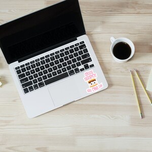 May include: A pink and white sticker with a cartoon s'more and the text "Speech Therapists Have S'more Fun". The sticker is on a laptop computer.