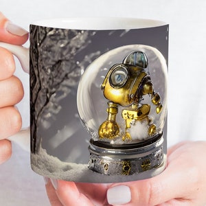 May include: A white ceramic mug with a snow globe design featuring a gold robot inside. The snow globe is sitting on a snowy surface with a tree branch in the background.