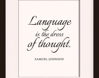 May include: A black framed print with a white background and the quote "Language is the dress of thought." by Samuel Johnson. The print is framed in an 11 x 14 frame with an 8 x 10 mat opening.