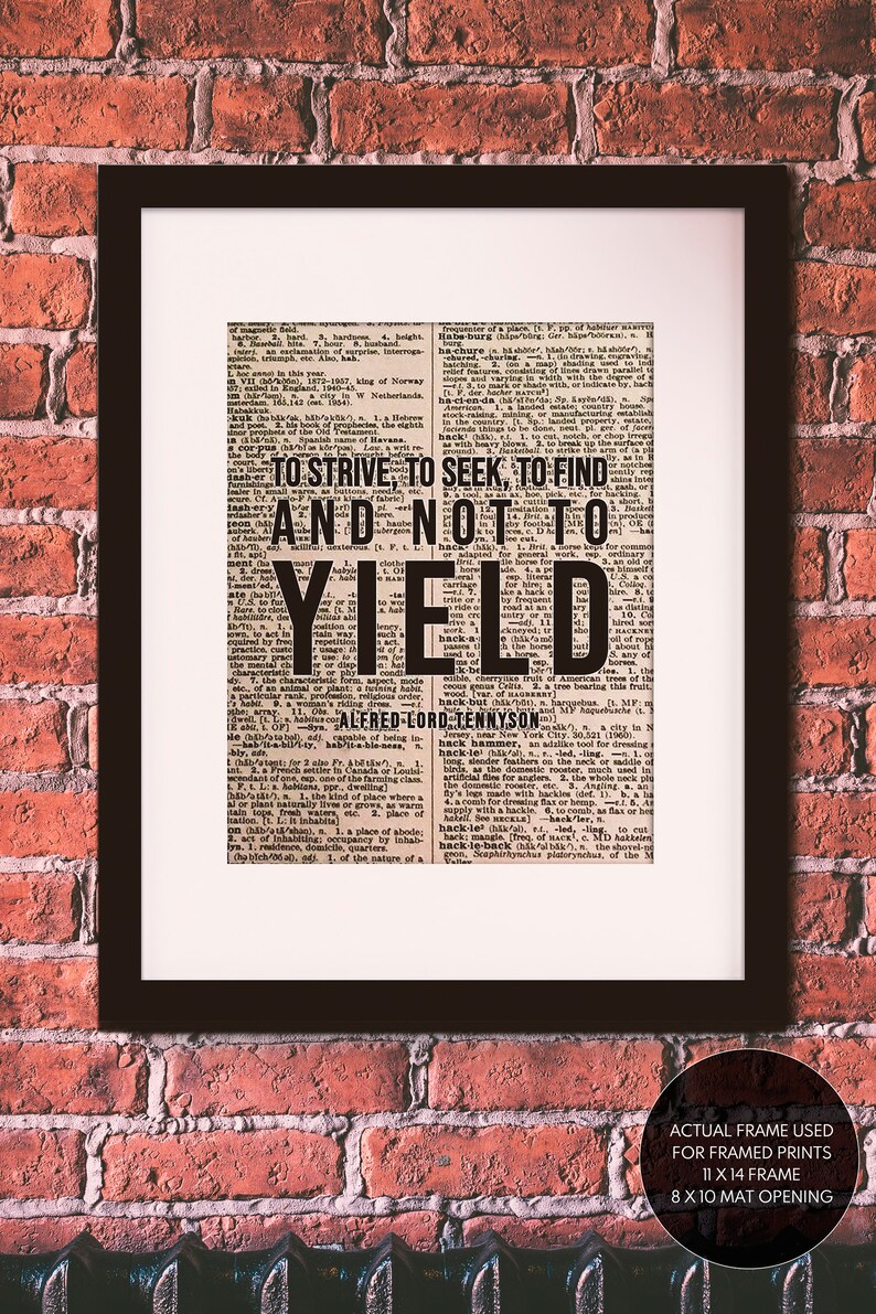 May include: A framed print of a vintage dictionary page with a quote by Alfred Lord Tennyson: "To strive, to seek, to find and not to yield". The print is in a black frame with a white mat.