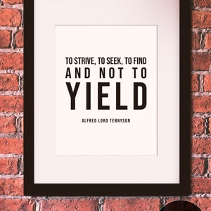 May include: A framed print with a black frame and a white background. The print features a black and white quote: "To strive, to seek, to find and not to yield." The quote is attributed to Alfred Lord Tennyson.