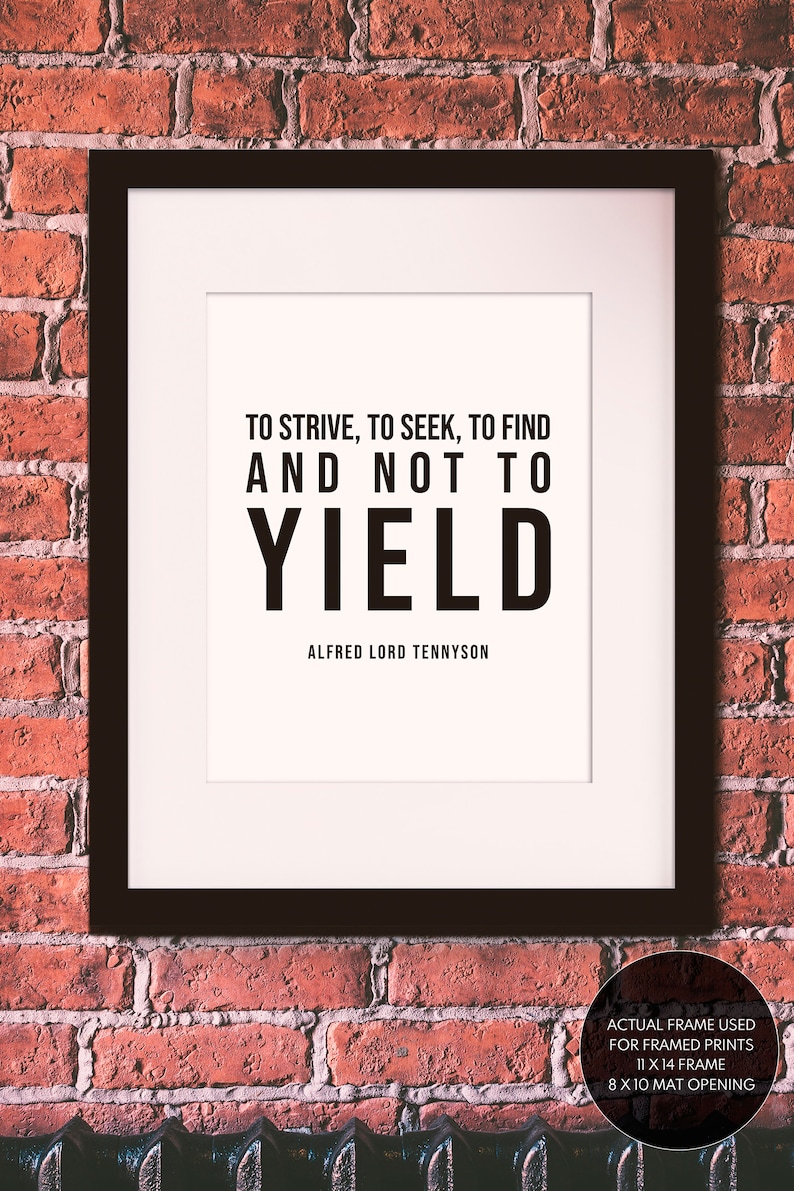 May include: A framed print with a black frame and a white background. The print features a black and white quote: "To strive, to seek, to find and not to yield." The quote is attributed to Alfred Lord Tennyson.