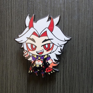 May include: A colorful enamel pin featuring a cartoon character with white hair, red horns, and red eyes. The character is wearing a black and purple outfit with gold accents. The pin has a black outline and is set against a gray background.