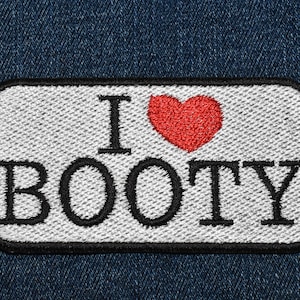 May include: White patch with black stitching and the text "I love BOOTY" with a red heart in between the words.
