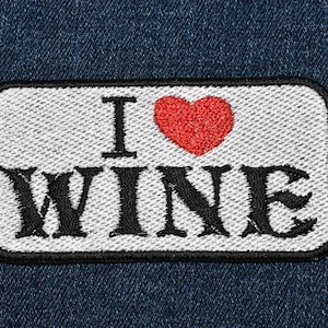 May include: White patch with black embroidered text "I love WINE" and a red heart.