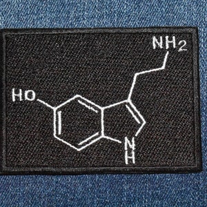May include: Black patch with a white embroidered chemical structure labeled "NH2" and "HO".