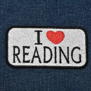 May include: White patch with black embroidered text "I love reading" and a red heart.