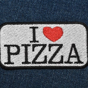 May include: White patch with black embroidered text "I love pizza" and a red heart.