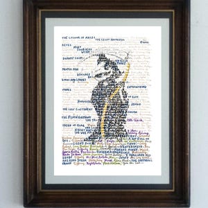 May include: Framed art print featuring a silhouette of a figure with a staff, composed of handwritten text. The artwork is in a dark wooden frame. The text includes phrases like "The Colour of Magic" and "The Light Fantastic".