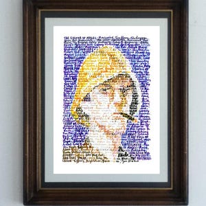 May include: Framed art print featuring a portrait composed of handwritten text in various colors. The subject's face is visible, with a yellow hat and a blue background. The frame is dark brown.
