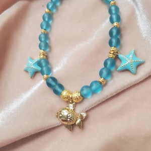 Puffy Gold plated 24k Fish with Light Sapphire Blue Starfish Charm Bracelet